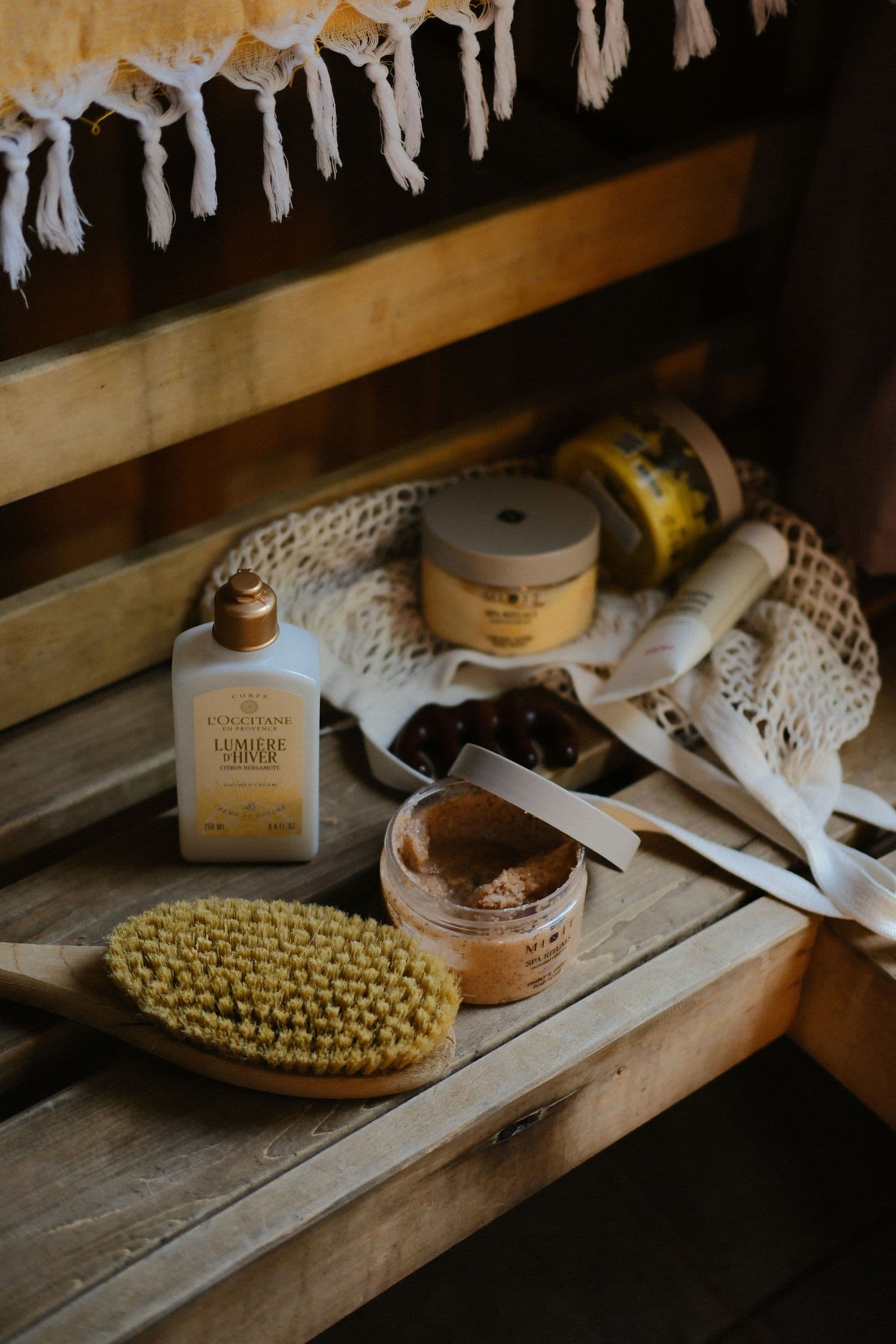 Body-care products and brushes laid out in a sauna