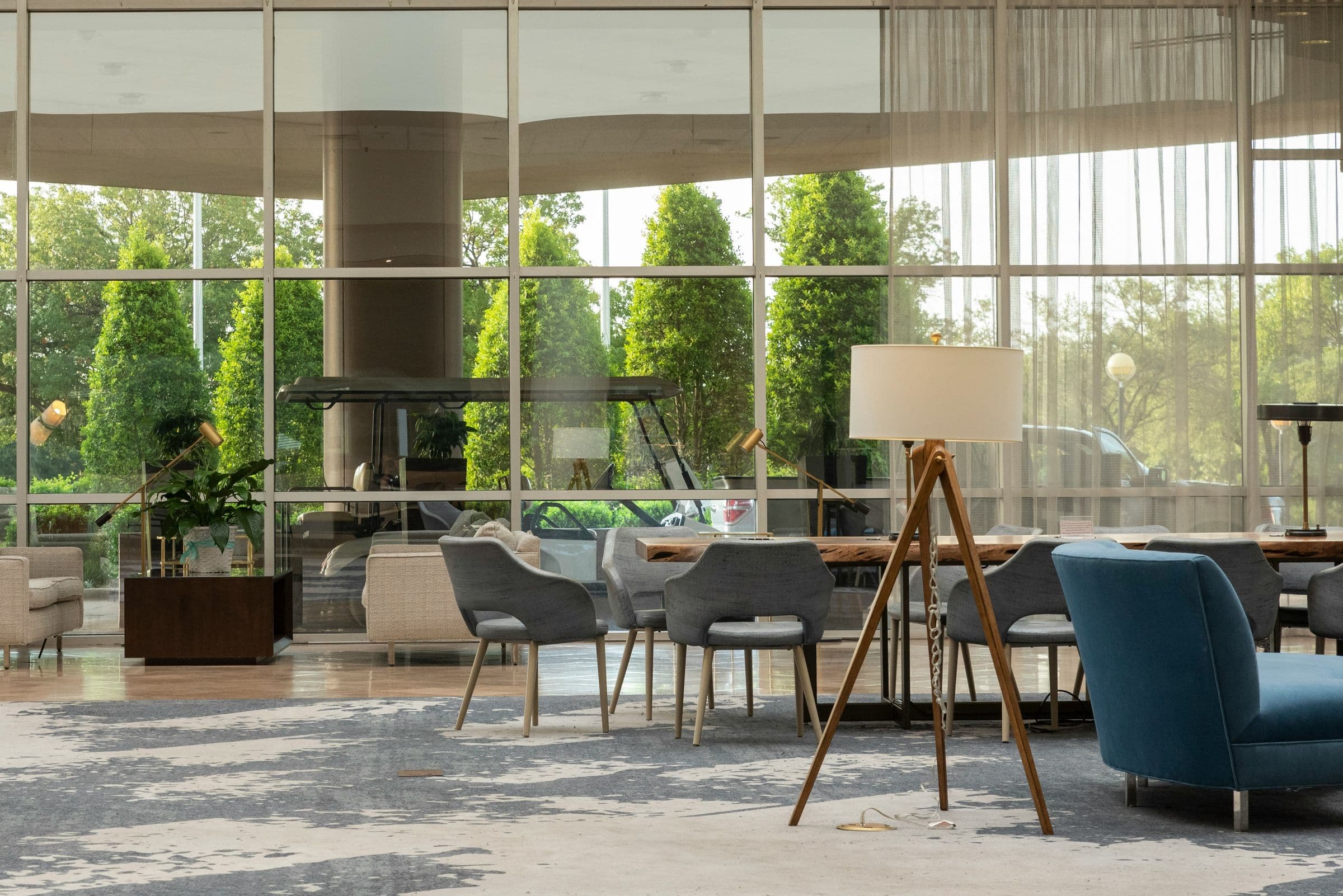 Lobby lounge with glass walls onto a garden