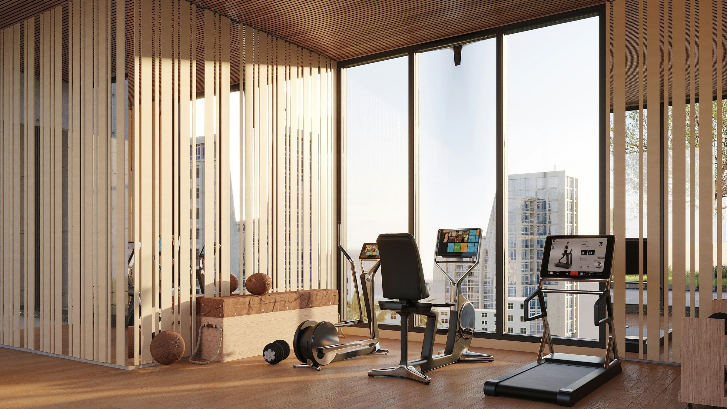 Hotel gym with floor-to-ceiling city views