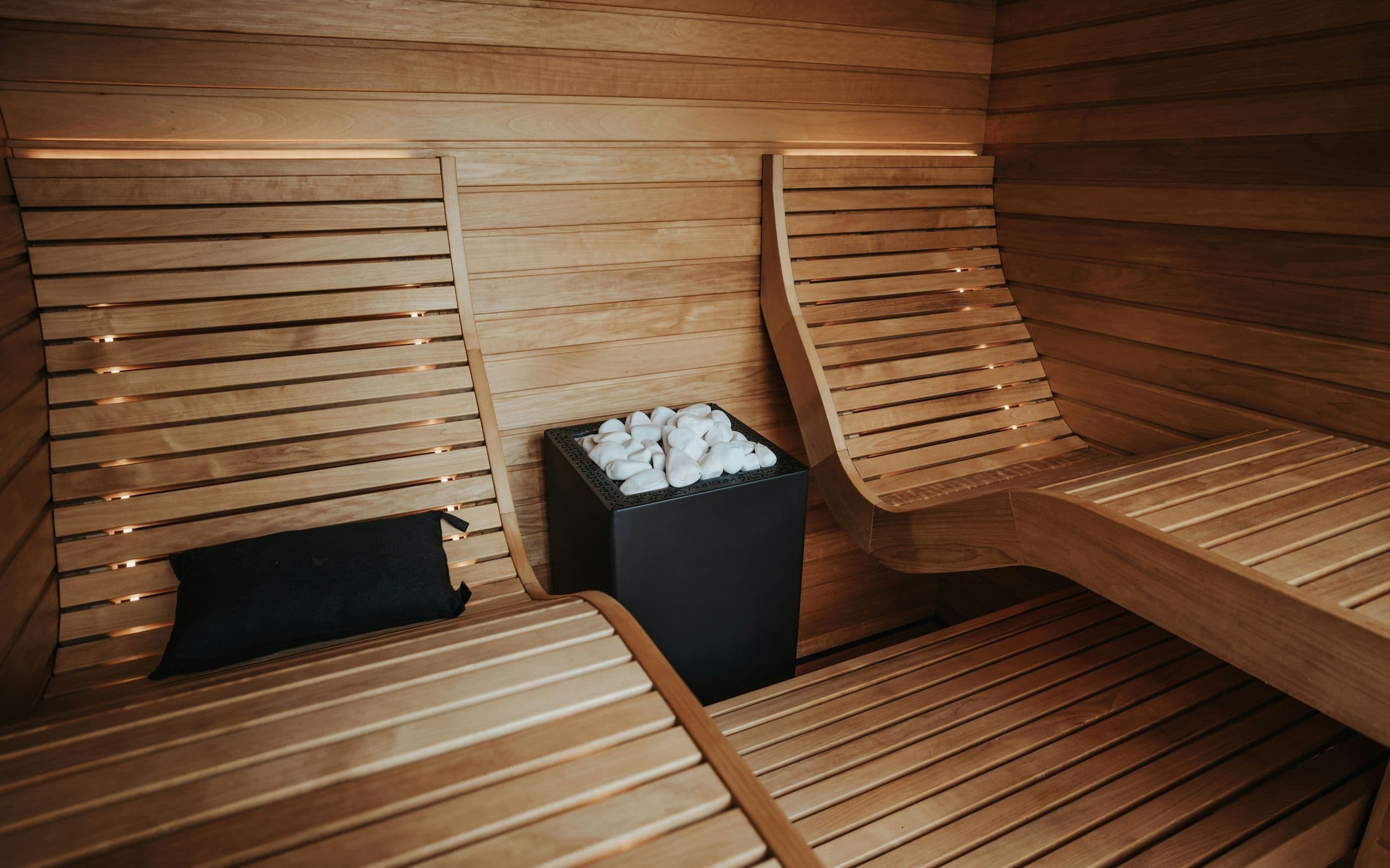 Timber sauna with reclining loungers