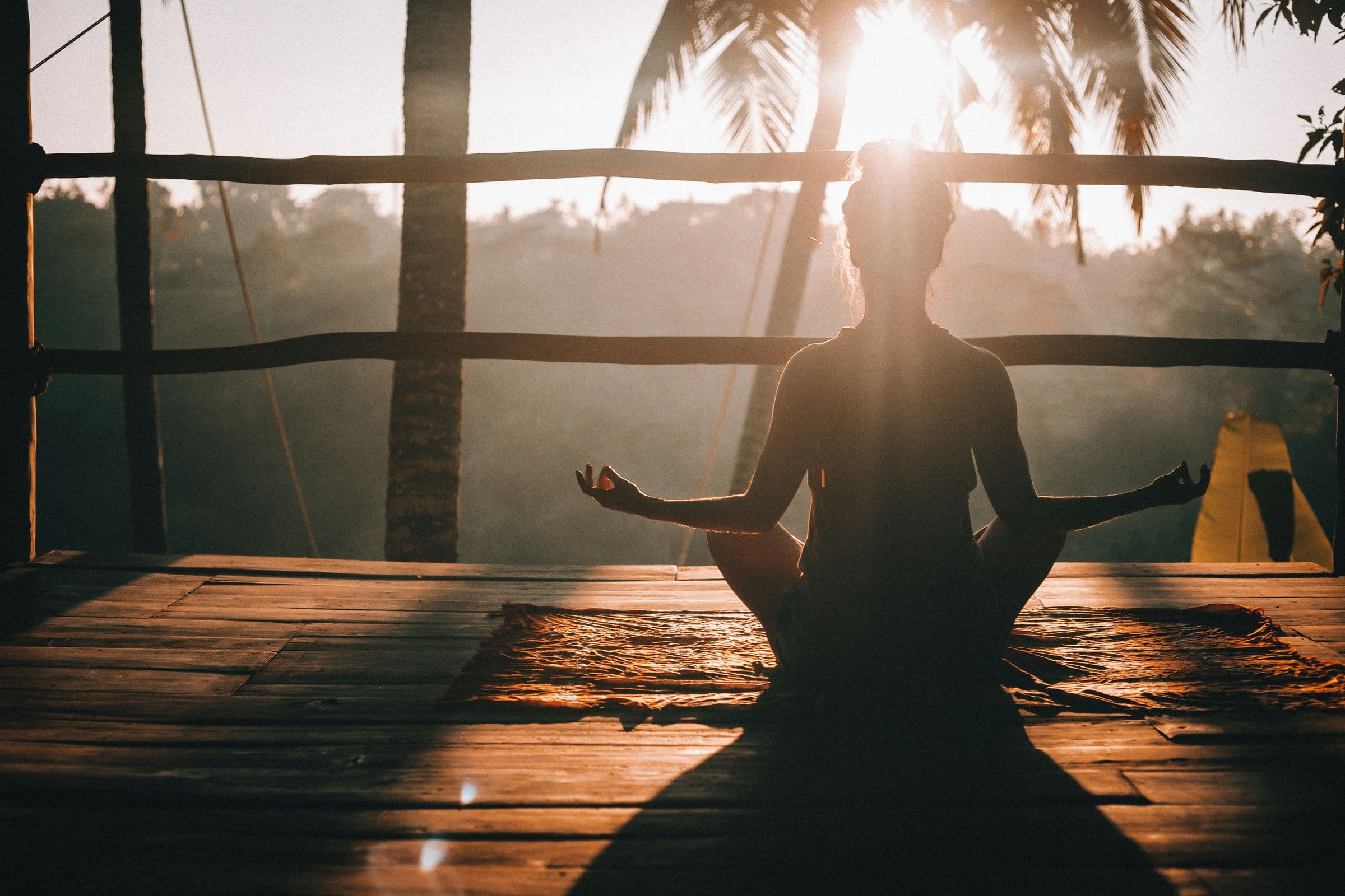 Yoga silhouette at sunrise